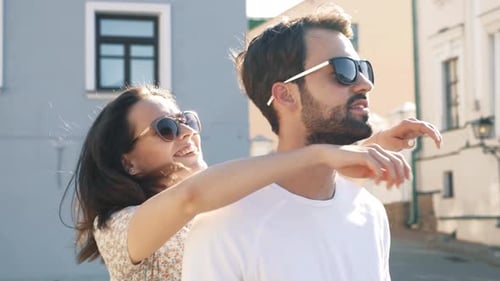 Young Couple Embracing on City Street