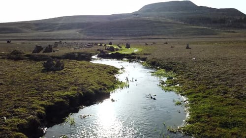 Flowing Stream and Fresh Water with Sun Reflection