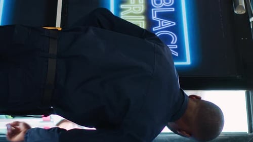 Vertical Video Security Officer Gives Access in Store