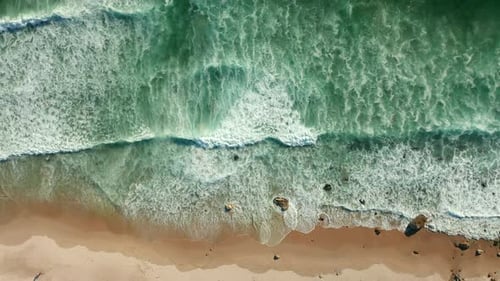 Foamy Sea Waves Splashing On Sandy Shore At Kogel Bay Beach, Cape Town, South Africa - aerial top do