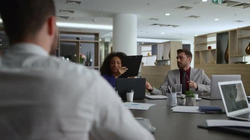 Business Team Meeting at Conference Table