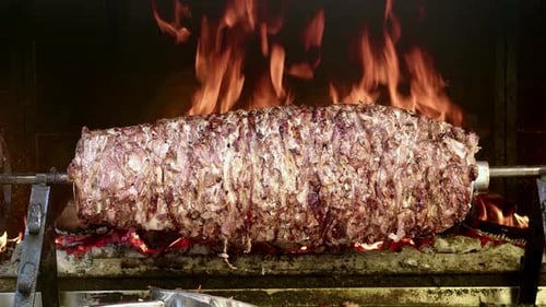Giant Meat Kebab Roasting Over Fiery Coals