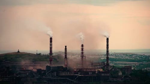 Factory Pipes Producing Dirty Smoke Clouds