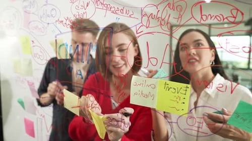 Creative Team Brainstorming Ideas in a Bright Workplace