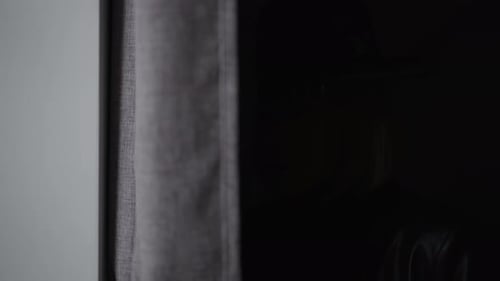 Woman with Hat Looking Through Binoculars, Indoors