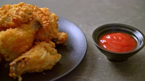 fried chicken wings with ketchup