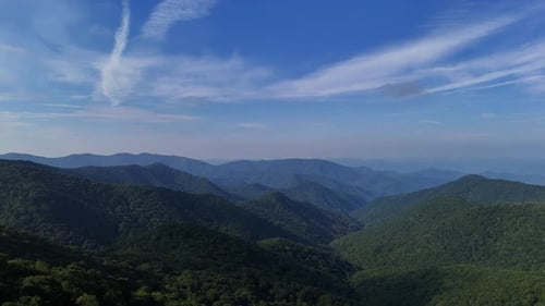 Green Mountain Range Under Streaked Blue Sky
