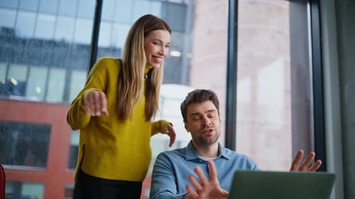 Enthusiastic Colleagues Video Conferencing in Modern Office