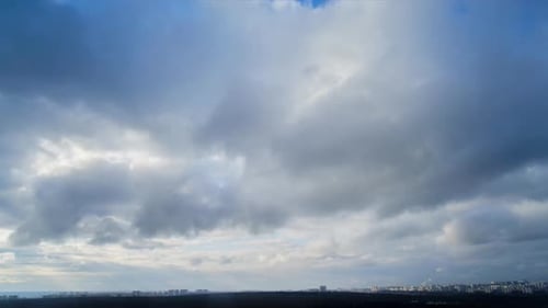 Time Lapse of Clouds Above an Urban Skyline