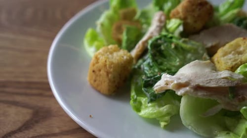 caesar salad with chicken on plate