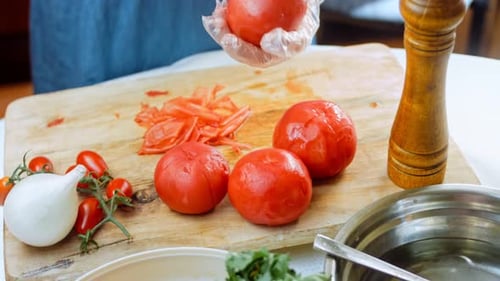 Preparing fresh tomatoes on a cutting board