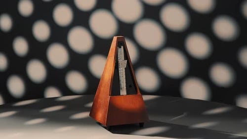 Not Working Metronome Rotates 360 Degrees on a Dark Background Metronome Stands Still