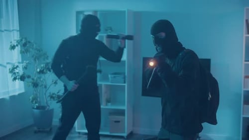 Masked Men Indoors Holding Flashlights and Crowbar