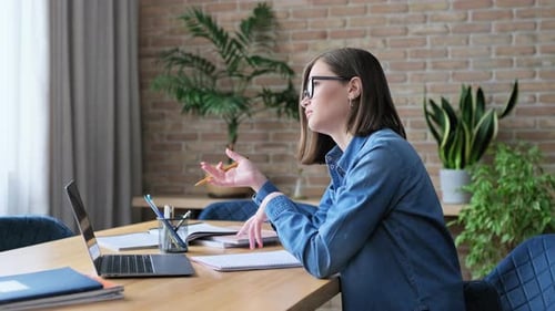 Woman on Video Call at Home Office Desk