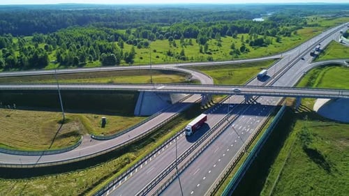 Transport Interchange on the Highway Aerial of Cars Drive Along the Highway Outside the City