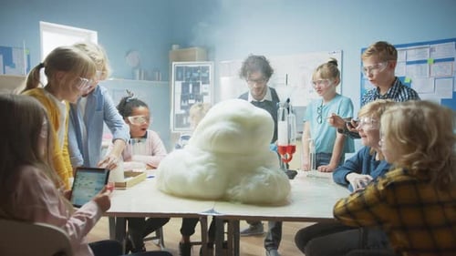 Elementary School Science / Chemistry Classroom: Enthusiastic Teacher Shows Funny Chemical Reaction