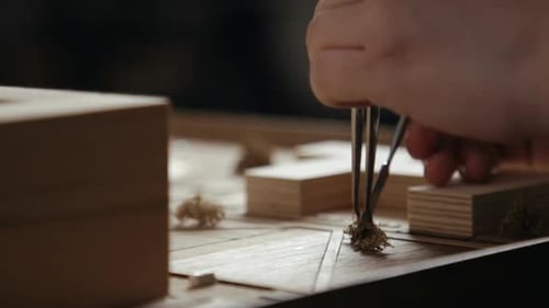 Creating an architectural model with small wooden blocks