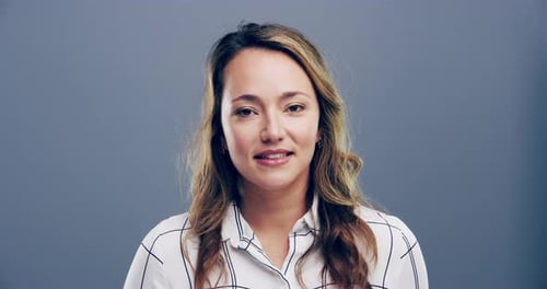 Woman Smiling and Talking in Studio