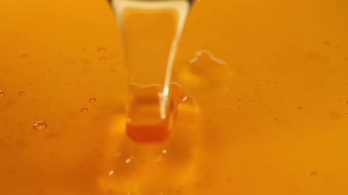 Thick Honey Dripping, Close Up Of Pouring Honey On Honey, Sweet Dessert