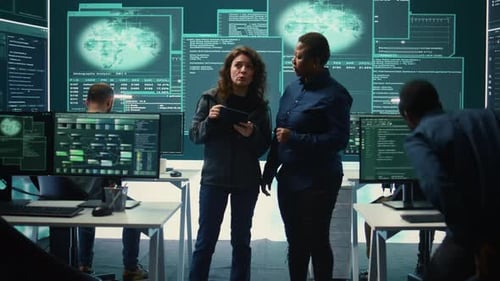 Team Collaborating in High-Tech Security Office