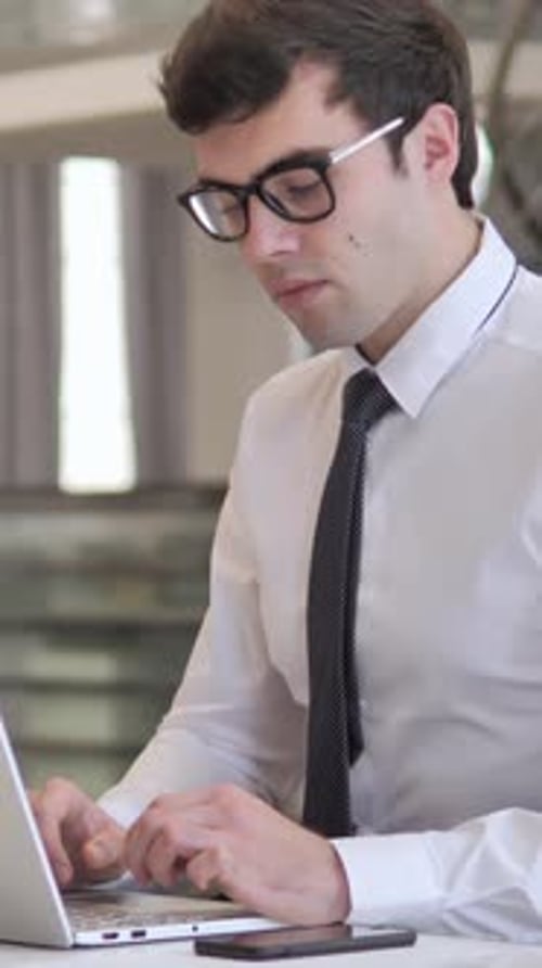 Man Working on Laptop and Giving Thumbs Up