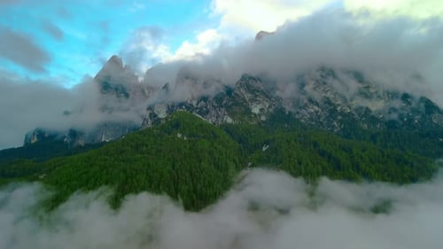 Lush Mountains Surrounded By Fog and Cloud Cover , Aerial View - Establishing Drone Shot