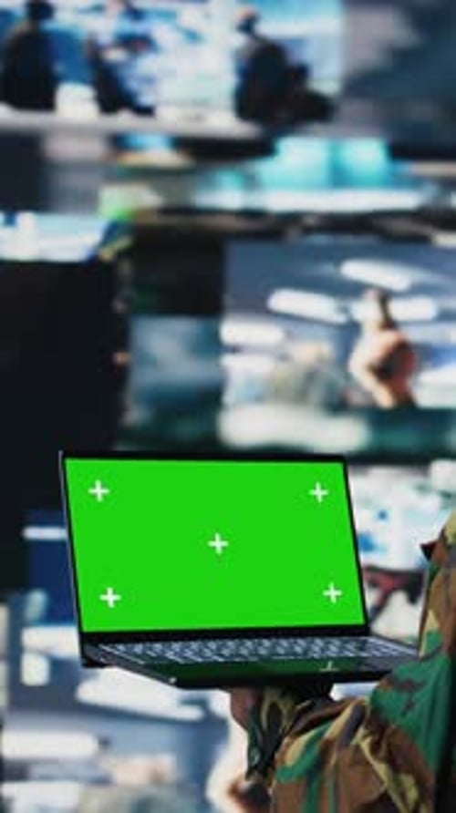 Vertical Video Black Army Officer Reviewing Satellite Imagery with Chroma Key on Pc