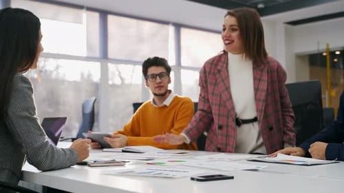 Businesswomen Negotiate and Reach Successful Agreement By Shaking Hands in Office Partners Signing