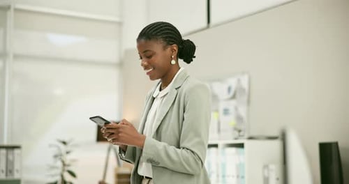 Happy black woman, phone and walking at office for communication, social media or networking