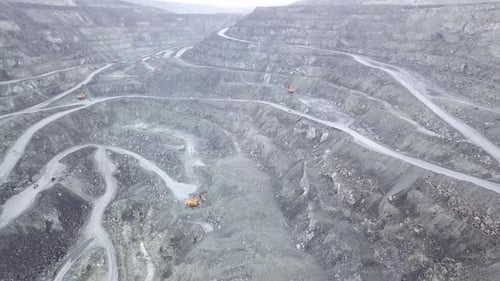 This is an Aerial View Showcasing an Expansive OpenPit Mining Operation Situated Below