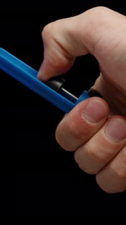 Hand Using Desoldering Pump Solder Sucker