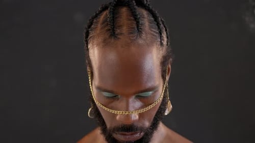 Black Serious Gay Stands Isolated on Black Background
