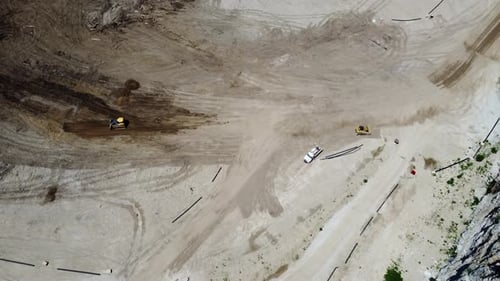 Aerial View of Bulldozers at Construction Site