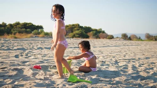 A Morning At The Beach With Children Playing