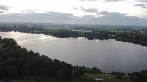 Beautiful lake with sunset about to happen on a cloudy day.