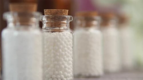 Homeopathic Medicine Bottles Filled with White Sugar Pellets