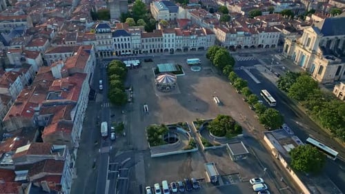 Forward aerial movement above the Place de Verdun with La Rochelle Cathedral, La Rochelle, France.