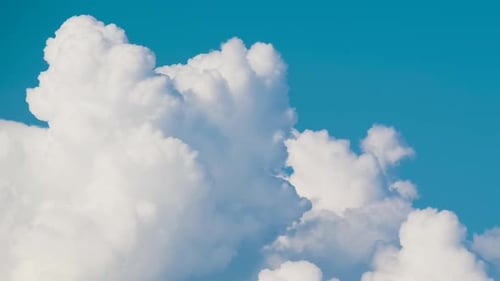 Timelapse of White Puffy Cumulus Clouds Forming on Summer Blue Sky