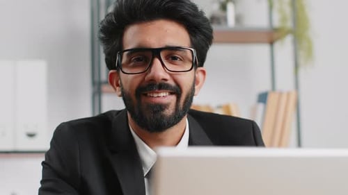 Closeup Businessman Freelancer at Office Workplace Working on Laptop Computer Sends Online Messages