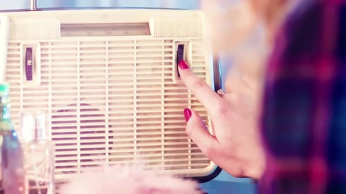 Vintage Radio Being Tuned By A Woman