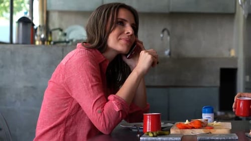 Woman Eating Pickles While Talking on Phone