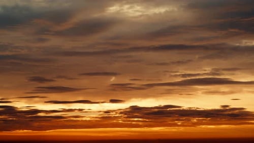 Golden Sunset Sky with Dynamic Cloud Movement