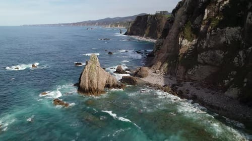 Wild pebble beach in north Spain, Asturias. Aerial shot over the Cantabrian Sea in Playa de los