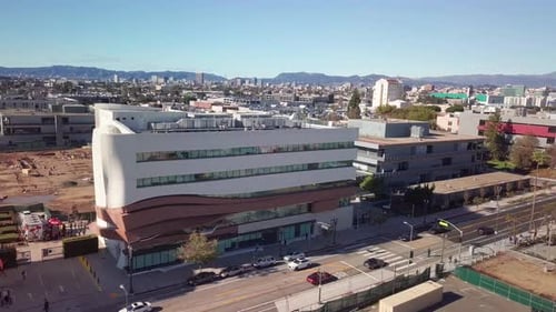 Panning aerial shot of South Grand Avenue with Downtown Los Angeles in the background. 4K