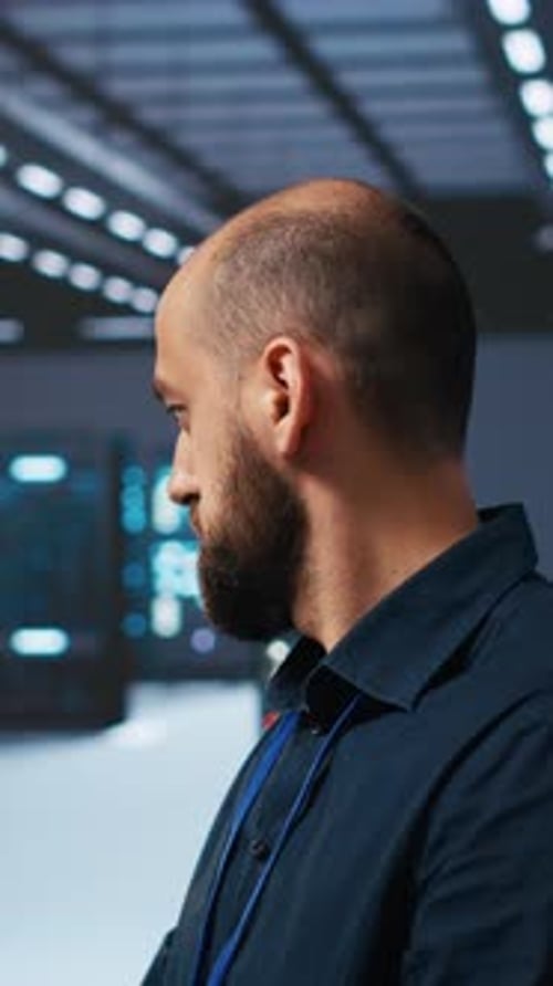 Vertical Video Programmer Writing Code Working in Network Security Data Center