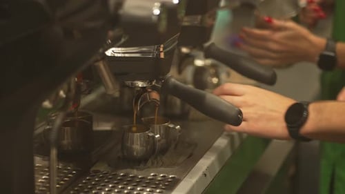 Espresso Machine Pouring Coffee in Silver Pitchers