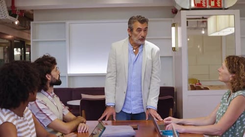 Business Meeting with Diverse Adults at Office