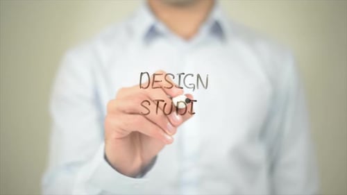 Design Studio Man Writing on Transparent Screen