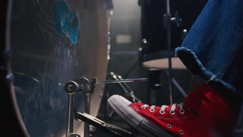Close Up Foot in a Red Shoe Presses on Pedal of Drums Rhythmically Playing Drummer Hits Bass Drum