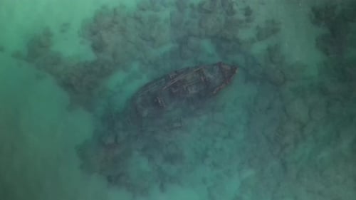 Aerial View Of Tourists Paddle Boarding By Shipwreck In Ocean, Tourists Enjoying Vacation – Arsuf